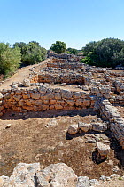 Ruins of ancient stone houses at Capocorb Vell, a much excavated settlement built by the Talaiotic culture, which flourished in Mallorca between around 1300 and 800 BC, near Cala Pi, Mallorca. May 201...