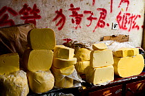 Yak (Bos grunniens) butter on stall at Tibetan market. Litang, Garze Tibetan Autonomous Prefecture, Sichuan, China. 2016.