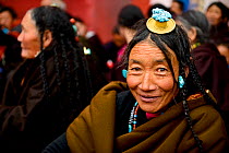 Tibetan pilgrim on kora, a sacred pilgrimage around Gonchen Gompa / Derge Monastery, portrait. Derge, Garze Tibetan Autonomous Prefecture, Sichuan, China. 2016.