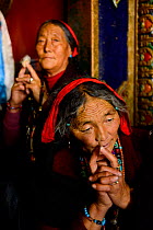 Tibetan pilgrims making kora, a sacred pilgrimage around Gonchen Gompa / Derge Monastery. Derge, Garze Tibetan Autonomous Prefecture, Sichuan, China. 2016.