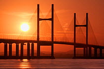 Second Severn Crossing suspension bridge over River Severn between England and Wales, at sunset. Gloucestershire, England, UK. September 2006.