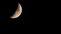 Waxing crescent moon, England.