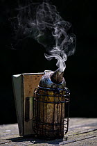 Bee smoker. Important equipment of a beekeeper to calm down Honey bees (Apis Mellifera), Germany