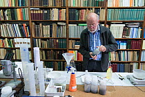 Entomologist with sample of insects caught in malaise trap. Long-term monitoring has revealed a 75% decline in insect biomass over 27 years. Entomological Society Krefeld, Germany 2019.