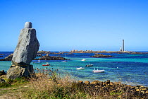 Statue of Victor Hugo and the &#39;Phare de l&#39;le Vierge&#39;, tallest stone lighthouse in Europe, Lilia, Plouguerneau, Finistere, Brittany. September 2019