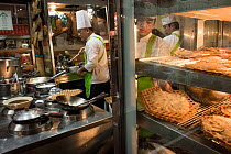 Kitchen staff prepare shark fin soup at a Chinese restaurant in the Chinatown of Bangkok, Thailand, February 2015.