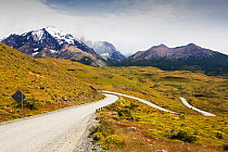 Winding gravel road through mountains. Torres del Paine National Park, Patagonia, Chile. January 2020.