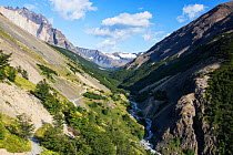 Mountain valley viewed from path up to Torres del Paine peaks. Torres del Paine National Park, Patagonia, Chile. January 2020.