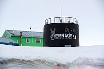 Fuel tank and buildings at Vernadsky Station Ukrainian research base, a former British base. Galindez Island, Antarctica. January 2020.