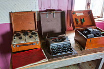 Equipment including typewriter in Wordie House, a former British scientific research base. Winter Island, Argentine Islands, Antarctica. 2020.