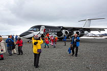 Tourists landing at Frei Station during Antarctic tourism trip from Punta Arenas, Chile. King George Island, South Shetland Islands. December 2019.