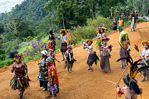 Kiowe villagers participating in traditional welcome ceremony. Eastern Highlands, Papua New Guinea. 2019.