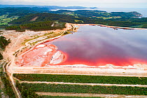 Aerial view of red mud / alumina deposits, where with a highly alkaline waste product produced by the industrial production of aluminium is stored. Located on seashore in Galicia, Northern Spain.