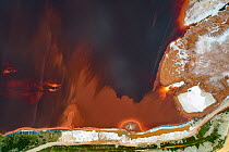 Aerial view of red mud / alumina deposits, where with a highly alkaline waste product produced by the industrial production of aluminium is stored. Located on seashore in Galicia, Northern Spain.
