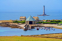 Phare de Goury lighthouse and lifeboat station in the port near Auderville at the Cap de La Hague, Cotentin peninsula, Lower Normandy, France. August 2020