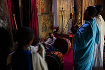Deacons and students singing during Sunday service at Debre Sina Orthodox Church. Near Gorgora, Ethiopia. 2018.