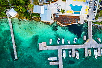 Hotel with marina constructed in a seagrass bed, aerial view. Harbour Island, Bahamas. 2019.