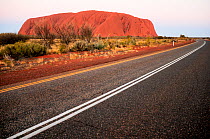Road beside Uluru / Ayers Rock. Uluru-Kata Tjuta National Park, Northern Territory, Australia.