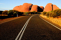 Road approaching Uluru / Ayers Rock. Uluru-Kata Tjuta National Park, Northern Territory, Australia.