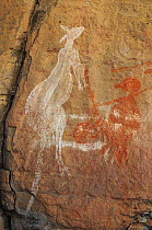 Aboriginal rock art depicting a kangaroo and human figure. Kakadu National Park, Northern Territory, Australia.