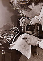 Electronics engineer Ron Perkins working on Stephen Dalton&#39;s high-speed flash unit, early 1970s.