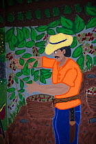 Mural of farmer picking Coffee (Coffea arabica) cherries. Organic coffee plantation near La Amistad International Park, Costa Rica. 2018.
