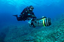 Scuba diver with underwater scooter, Ponza Island, Italy, Tyrrhenian Sea, Mediterranean.