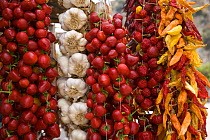 Stall with red chilli, garlic and cherry tomato for sale, Penisola Sorrentina, Costa Amalfitana, Italy.