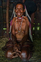 Dani tribe woman inside home. Budaya village, Suroba, Trikora Mountains, West Papua, Indonesia. March 2018.