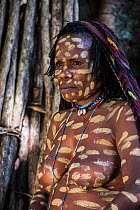 Dani tribe woman, with clay markings. Jiwika village, Suroba, Trikora Mountains, West Papua, Indonesia. October 2020.