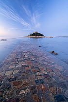 Cobbled causeway leading to St Michael's Mount, underwater at high tide. Marazion, Cornwall, England, UK. October 2020.