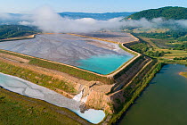 Aerial view of ash pond, Montenegro. After coal is burned in power plants, the waste ash is mixed with water and pumped through pipelines into sludgy lagoons commonly known as ash ponds. The ponds are...