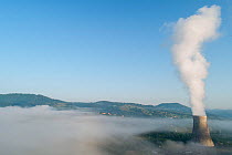 Cooling tower of thermal power plant in Montenegro, surrounded with fog.