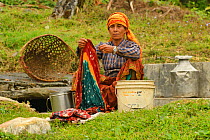 Woman washing clothes near Pokhara, Nepal. March 2019.