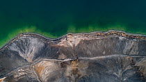 Aerial view of ash pond near Turek, Poland. Former open pit coal mine now used to store coal ash after burning in power plants. The ash is mixed with water and pumped through a pipeline into the ash p...