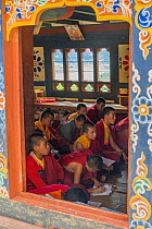 Young Buddhist monks in class. Chime Lhakhang Temple (The &#39;fertility temple&#39;). Bhutan. September 2013.