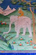 Buddhist artwork of Elephant and rider with rabbit and bird. Trongas Dzong. The largest fortress in Bhutan. September 2013.