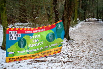 Surrey Country Council sign reminding walkers of the importance of Social Distancing outside during COVID-19 Lockdown, close to Starveall corner car park, Mole Valley, Surrey, UK, January 2021