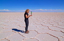 Forced Perspective photo of a giant in the saltflats of Salar de Uyuni, Bolivia.