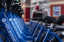Melbourne Bike Share bikes racked up in front of Luna Park in St Kilda, Victoria, Australia. May 2016. Editorial use only.