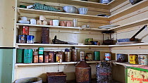 Zoom out of kitchen area in Station W, a former British scientific research station, left as it was after researchers evacuated in 1959, Detaille Island, Graham Land, Antarctica, 2020.