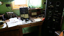 Zoom out of radio room in Station W, a former British scientific research station evacuated in 1959. Detaille Island, Graham Land, Antarctica. 2020