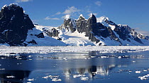 Tracking shot of Antarctic scenery surrounding the Lemaire channel, between Booth Island and the Kiev Peninsular from Peterman Island.