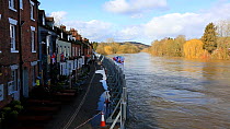 Flood defences holding back the River Severn floodwaters along street in Bewdley. The river overtopped the barriers after Storm Ciara and Storm Dennis, the wettest February recorded in the UK. Worcest...