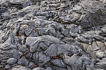 Field of solidified lava, with flowing lava underneath, at the Fagradalsfjall volcano, Iceland. 4 April 2021.