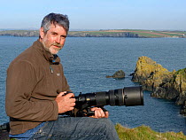 Portrait of wildlife photographer Nick Upton on a coastal shoot in North Cornwall, UK. Model released. 2017