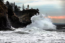 Crashing surf at Cape Disappointment Lighthouse near the outflow of the Columbia River in Cape Disappointment State Park, Washington state, USA.
