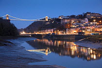 The Avon River, Hotwells and Clifton Suspension Bridge over the Avon Gorge at dusk, Bristol, England, UK. January 2018.