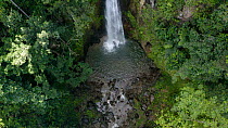 Drone shot tilting up Syndicate waterfall, Dominica, Eastern Caribbean, 2020.