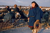 Dmitri Khorolya, a Nenets reindeer herder at a reindeer corral near Yarudey, Western Siberia, Russia. 1996.